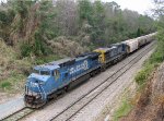 CSX 7323 leads a grain train held at Rice Street